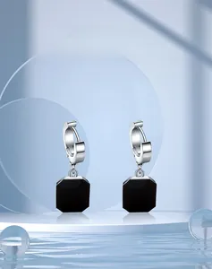 Close-up of geometric square black gemstone drop earrings in silver stainless steel