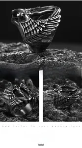 Detailed view of vintage angel wing carving on stainless steel ring with antique finish