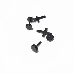 Men's black stainless steel cross earrings set with screw back studs on white background