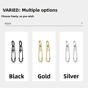 Polished stainless steel safety pin earrings with cross charms in black, gold, and silver