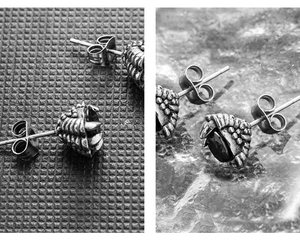 Macro shot of punk style dragon claw studs with faceted black stones and scale details