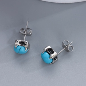 Retro stainless steel eagle claw stud earrings with round turquoise stone accents