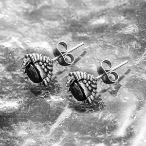 Gothic dragon claw stud earrings in stainless steel featuring an oval black stone setting