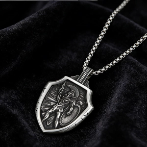 Macro shot of Viking Mjolnir pendant with Spartan warrior relief in vintage steel