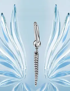 Detail of silver titanium steel hoop earring with a spiral cone pendant on glass
