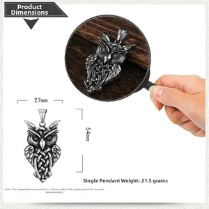 Detail of owl pendant featuring intricate Celtic knot patterns in vintage stainless steel