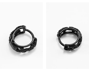 Detailed view of black vintage engraved stainless steel hoop earrings with intricate patterns