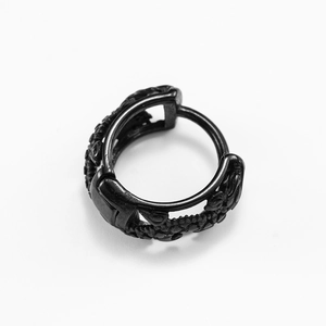 Black stainless steel huggie earrings featuring vintage embossed vine patterns on white