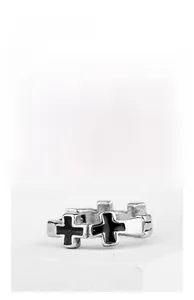 Macro detail of gothic style stainless steel double cross earring with black enamel finish