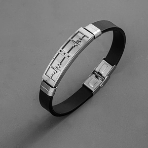 Close-up of black silicone band with stainless steel heartbeat plate and clasp