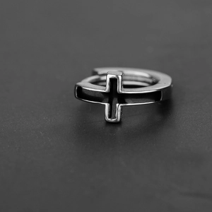 Minimalist silver stainless steel huggie hoop earrings featuring black enamel cross design