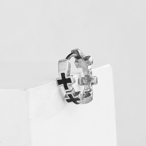 Minimalist silver steel hoop earrings with black gothic cross pattern on white background
