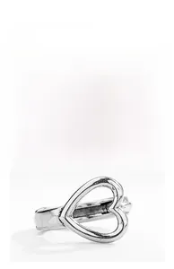 Macro shot of minimalist hollow heart-shaped earring detail in polished stainless steel