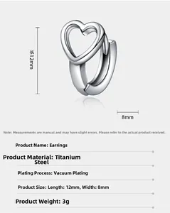 Macro shot of silver hollow heart earrings in titanium steel with vacuum plating detail