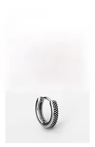 Detailed view of vintage stainless steel hoop earring with textured bead pattern