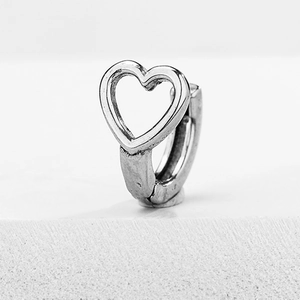 Minimalist silver heart hoop earring with sleek cutout design and polished metal finish