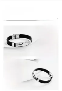 Detail of mirror-polished stainless steel buckle with steel stamp on black silicone band