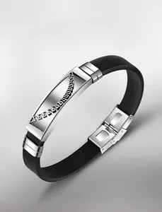 Detail of stainless steel Greek meander pattern on a black silicone bracelet band
