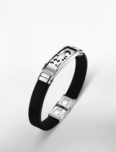 Detailed view of Scorpio hollowed stainless steel plate on black silicone sports bracelet