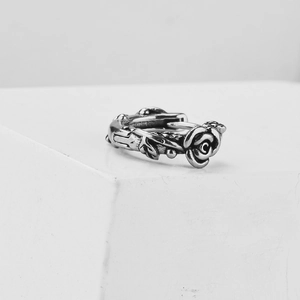 Vintage style stainless steel rose flower hoop earring with detailed silver texture