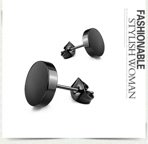 Detail of black stainless steel stud earrings featuring a minimalist round design