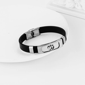 Men's hollow crown stainless steel and black silicone sports bracelet on white display