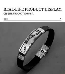 Detail of men's silicone bracelet with hollow Greek pattern engraved on steel plate