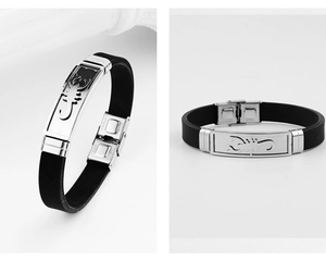 Detail of men's silicone bracelet with stainless steel scorpion plate and fold-over clasp