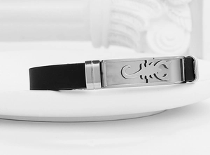 Detail of black silicone wristband featuring a hollow scorpion totem stainless steel plate