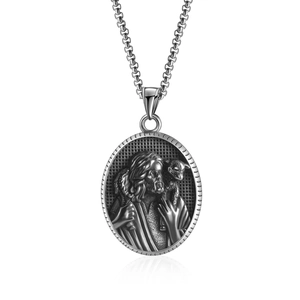 Vintage stainless steel oval pendant necklace featuring a detailed religious Jesus relief