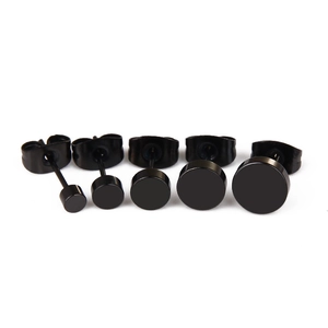 Five pairs of black punk rock stainless steel stud earrings in varying circular sizes