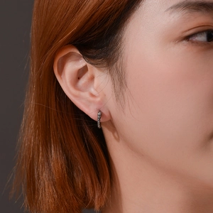 Minimalist vintage dragon scale pattern huggie earrings in textured surgical steel
