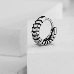 Retro stainless steel hoop earrings with textured horizontal ridges and antique finish