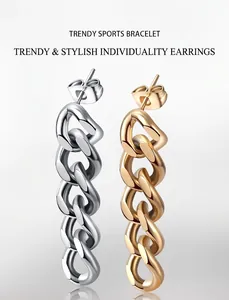 Detail view of Cuban link chain stud earrings in polished silver and gold finishes