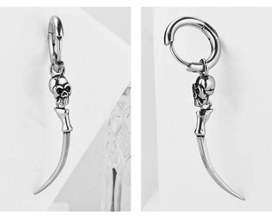 Detailed view of Gothic skull earring with curved horn in vintage stainless steel