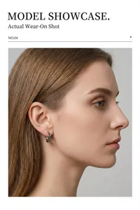 Detail shot of a silver minimalist stainless steel hoop earring with engraved patterns