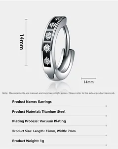Detail view of 15mm titanium steel hoop earring with black finish and daisy pattern