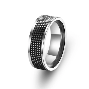 Polished stainless steel ring with black checkered pattern texture in a 45-degree angle