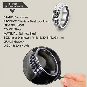 Detailed view of silver stainless steel ring featuring a vintage braided scale texture