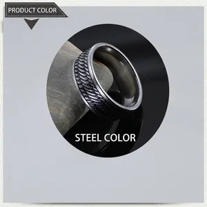 Detailed macro view of steel color ring with intricate vine leaf feather textures