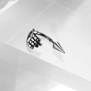 Punk style stainless steel curved barbell with a palm hand and sharp cone spike charm