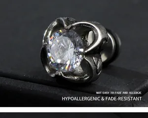 Macro shot of vintage style stainless steel crown earring with clear cubic zirconia