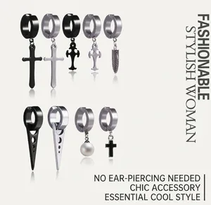 Detail of assorted stainless steel clip-on earrings with cross and spike charms
