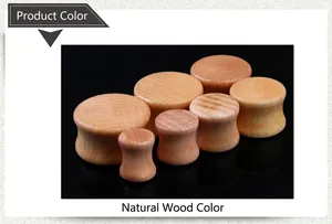 Detailed view of saddle wood ear plugs showing natural grain and polished finish