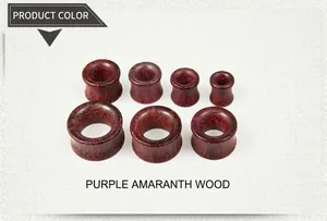 Detailed set of seven purpleheart wood ear gauges showing natural grain and sizes