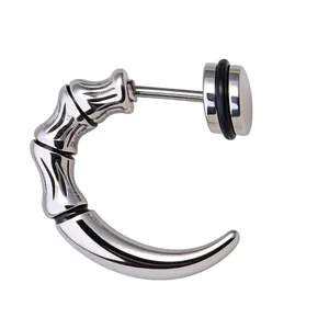 Detail view of silver stainless steel dragon claw earring with textured bamboo design