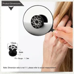 Macro detail of black dumbbell ear stud featuring a white seven-pointed star graphic