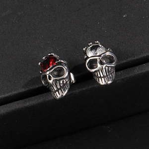 Skull stud earrings with crown-set red and white zircon in vintage stainless steel