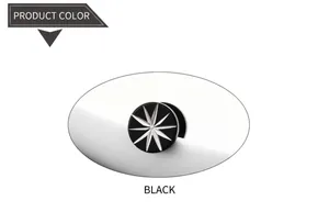 Detail of a black circular stud earring featuring a white eight-pointed star design