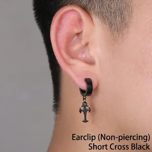 Close-up of black stainless steel cross clip-on earring worn on ear for non-pierced men